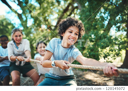 We learn so much more when we play. Shot of a group of teenagers playing a game of tug of war at summer camp. We learn so much more when we play. Shot of a group of teenagers playing a game of tug of war at summer camp. 120145072