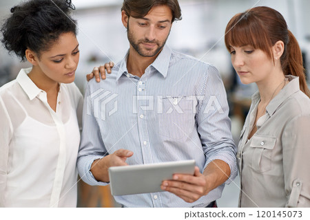 Making his point. Shot of three young business professionals having a meeting. 120145073