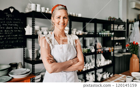 I am an artist and this is my studio. Cropped portrait of an attractive mature woman standing with her arms folded in her pottery workshop. I am an artist and this is my studio. Cropped portrait of an attractive mature woman standing with her arms folded in her pottery workshop. 120145159