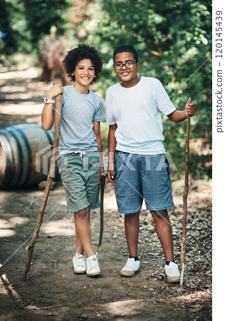 Childhood, what a wild adventure. Shot of two teenage boys exploring nature at summer camp. 120145439