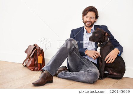 Hes my best friend. A handsome businessman sitting alongside his dog. Hes my best friend. A handsome businessman sitting alongside his dog. 120145669