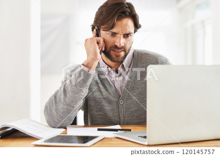 This is bad news. A handsome businessman speaking on his mobile at his desk. This is bad news. A handsome businessman speaking on his mobile at his desk. 120145757