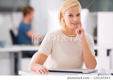 Dreams dont work unless you do. Cropped shot of an attractive young businesswoman in the office. 120145943