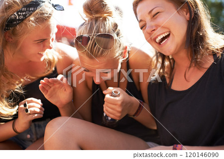 Girls gathered together and having a laugh. Three young girls sitting together and joking. Girls gathered together and having a laugh. Three young girls sitting together and joking. 120146090