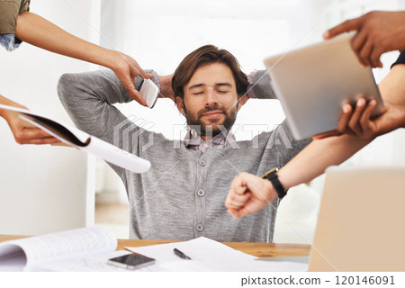 Delegation is key to avoiding burnout. A cropped shot of a handsome businessman with colleagues requesting various things from him. 120146091