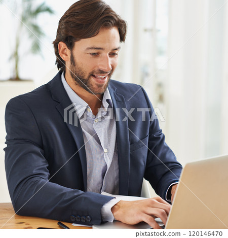 Work is a breeze today. A handsome businessman working on his laptop. Work is a breeze today. A handsome businessman working on his laptop. 120146470