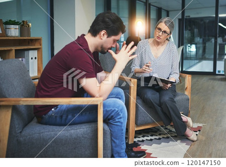 If it hurts, it needs to be healed. Shot of a young man having a therapeutic session with a psychologist and looking upset. If it hurts, it needs to be healed. Shot of a young man having a therapeutic session with a psychologist and looking upset. 120147150
