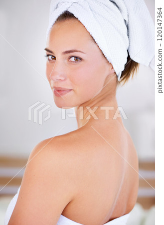 Feeling fresh and revitalised. Cropped shot of a beautiful woman during her morning beauty routine. 120147364