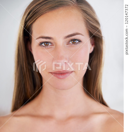 She treats her body like a temple. Head shot of a gorgeous brunette with a perfect complexion. 120147372