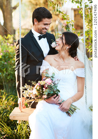 Youve made me the happiest man in this world. Shot of a happy newlywed young couple posing together outdoors on their wedding day. 120147496