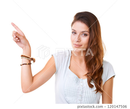 Right over there. Portrait of a gorgeous young woman pointing at copyspace. 120147506