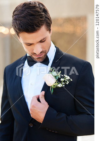 I think Im all set to say I do now. Shot of a handsome young bridegroom adjusting his suit and getting ready outdoors on his wedding day. 120147579