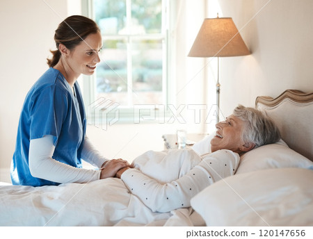 How did you sleep. Shot of a young nurse chatting with a senior woman in bed at a retirement home. How did you sleep. Shot of a young nurse chatting with a senior woman in bed at a retirement home. 120147656