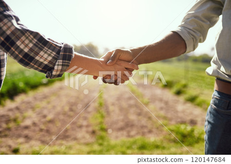Nicely done. Cropped shot of two unrecognizable farmers shaking hands while working on their farm. Nicely done. Cropped shot of two unrecognizable farmers shaking hands while working on their farm. 120147684