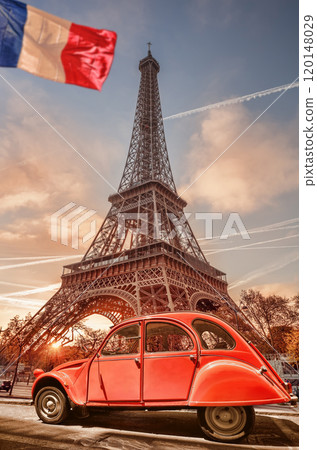Paris with two symbols the Eiffel Tower and old red car in France 120148029
