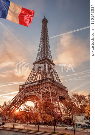 Eiffel Tower with flag of France in Paris, France 120148034