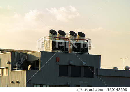Industrial air conditioning units on a rooftop. 120148398