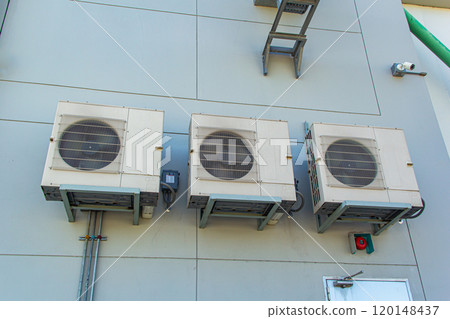 Air conditioners on wall of building, outdoors 120148437