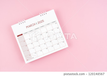 Top view on March desk calendar for 2025 year on pink background. 120148567