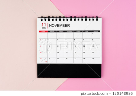 November 2025 desk calendar on pink background. Page of annual monthly calendar for your plan. November 2025 desk calendar on pink background. Page of annual monthly calendar for your plan. 120148986