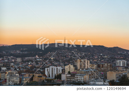 Golden hour over Tbilisi with a stunning view of city skyline and the surrounding mountains Golden hour over Tbilisi with a stunning view of city skyline and the surrounding mountains 120149694