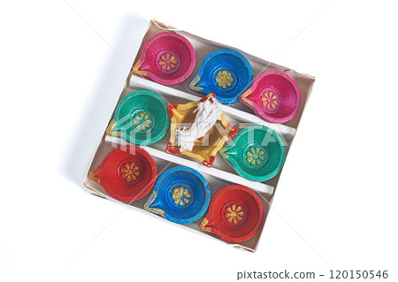 Colorful Diwali diyas arranged in box on white background. Indian festival decoration Colorful Diwali diyas arranged in box on white background. Indian festival decoration 120150546
