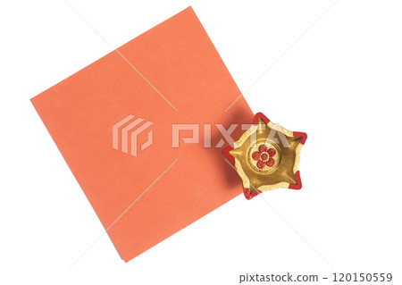 Decorative orange square paper with golden star shaped diya for festive celebrations 120150559