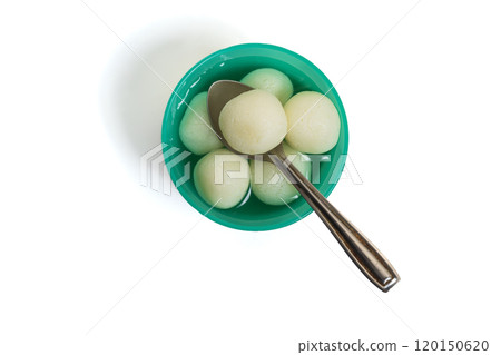 Top view of traditional Indian rasgulla dessert in green bowl with spoon on white background 120150620