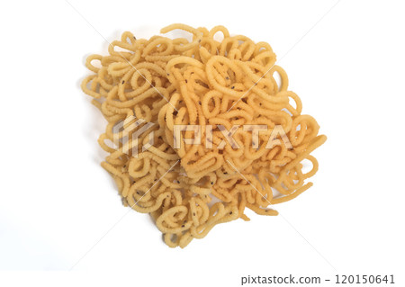 Traditional South Indian crunchy murukku snack isolated on white background. Top view. Traditional South Indian crunchy murukku snack isolated on white background. Top view. 120150641