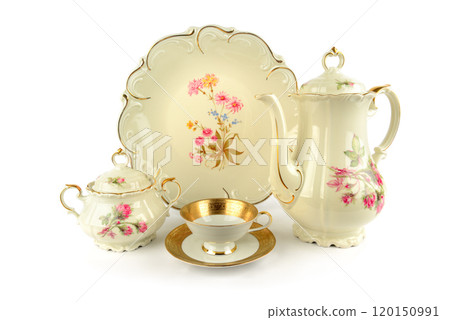 Vintage tea cup, sugar bowl, coffee pot and dish isolated on white. 120150991