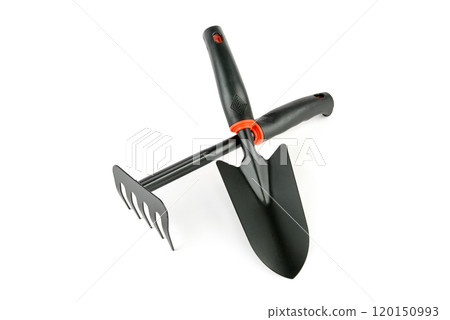 Rake and shovel isolated on white, top view. Gardening tool 120150993