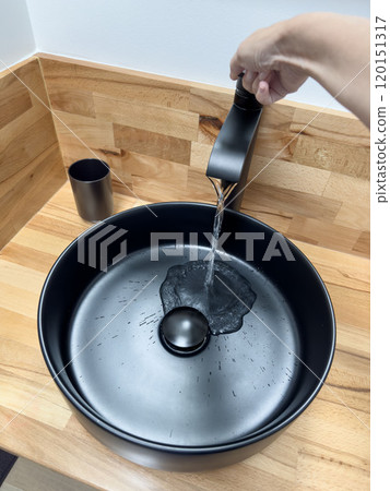 hand opens water tap or faucet in bathroom hand opens water tap or faucet in bathroom 120151317