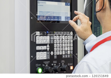 The operator working with CNC machine. 120151649