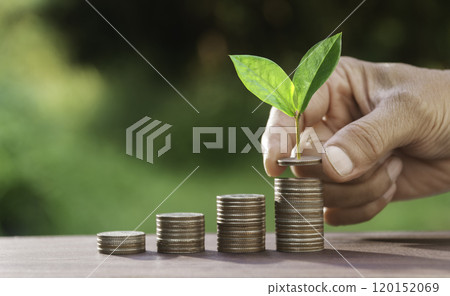 Hand with money coins stack, Business investment growth concept, saving concept, Hand putting stack of coin. Hand with money coins stack, Business investment growth concept, saving concept, Hand putting stack of coin. 120152069