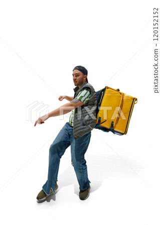 Full-length photo of young man dressed as courier with food delivery backpack posing with smiling expression against white studio background. Full-length photo of young man dressed as courier with food delivery backpack posing with smiling expression against white studio background. 120152152