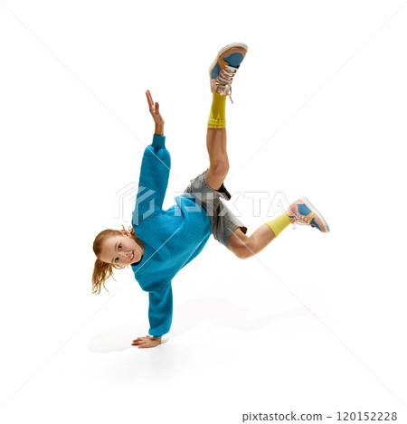 Carefree, happy teenage girl, dressed stylish oversized clothes, standing on hands and smiling against white studio background. Carefree, happy teenage girl, dressed stylish oversized clothes, standing on hands and smiling against white studio background. 120152228