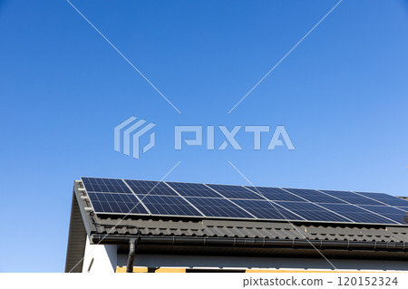 Clean alternative energy power in nature concept, sustainable resources. Modern house with solar panel stand-alone photovoltaic plant system on household metal sheet rooftop. Professional installation 120152324