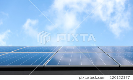 Aerial view of solar panel cells against cloudy blue sky. Alternative energy concept, sustainable resources. House with solar panels stand-alone photovoltaic plant system. Professional installation Aerial view of solar panel cells against cloudy blue sky. Alternative energy concept, sustainable resources. House with solar panels stand-alone photovoltaic plant system. Professional installation 120152377