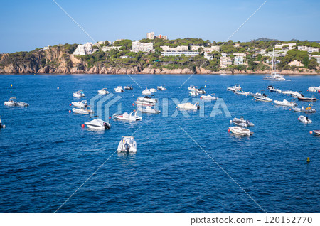 Yachts Anchored Along the Spanish Coastline Mediterranean Seaside View.vibrant photo of yachts and 120152770