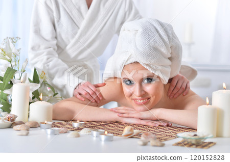 Beautiful woman in spa centar enjoying the massage. Beautiful woman in spa centar enjoying the massage. 120152828