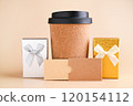 Eco-Friendly Coffee Cup with Gift Boxes Minimalist Holiday Gift Concept. tylish image featuring an 120154112