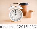 Minimalist Composition with Alarm Clock and EcoFriendly Coffee Cups Time and Sustainability 120154113