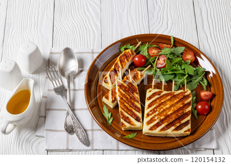 Grilled Greek Halloumi Cheese on sticks, top view Grilled Greek Halloumi Cheese on sticks, top view 120154132