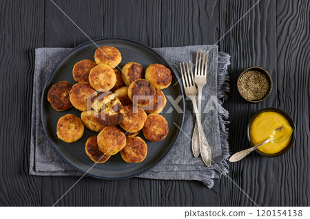 Northern Pike fish cakes on dark grey plate Northern Pike fish cakes on dark grey plate 120154138