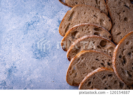 Sliced bread on blue backgrouns Sliced bread on blue backgrouns 120154887
