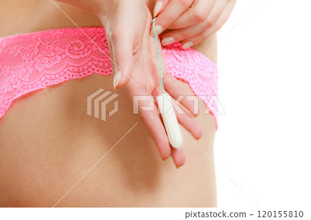 Woman with tampon in monthly cycle. 120155810