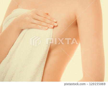 Woman covering breast under towel. Woman covering breast under towel. 120155869