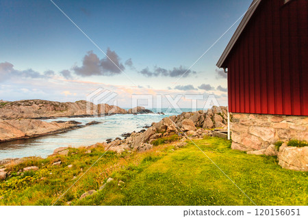 Houses along coastline near Lindesnes lighthouse 120156051