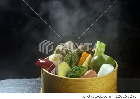 Steamed vegetables with rising steam Steamed vegetables with rising steam 120156253