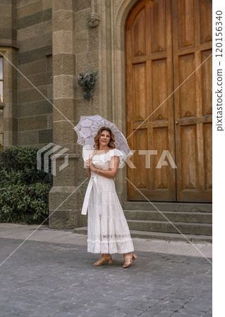 Woman White Dress Umbrella Church Entrance 120156340